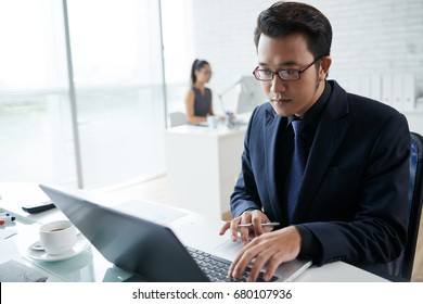 Vietnamese Businessman Laptop Concentrated On Work Stock Photo ...