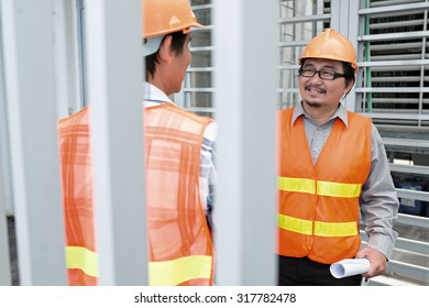 Vietnamese Construction Workers Talking Before Work