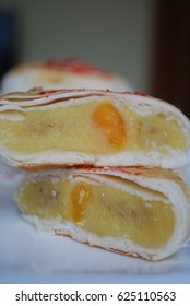 Vietnamese durian cake with salted egg yolk stacked on white ceramics plate. Banh Pia