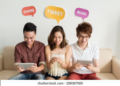 Vietnamese Friends Using Social Media From Different Mobile Devices