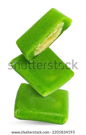 Vietnamese Green rice flake cake with buttery mung beans (or Banh Com) isolated on white background