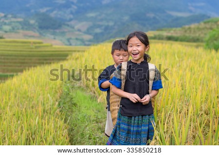 Vietnamese Hmong children smiling in rice terrace river side o at mu cang chai district,Yenbai province, northwest of Vietnam.
