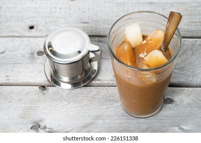 Vietnamese Ice Coffee With Condensed Milk, Cafe Sua Da On A Wooden Background