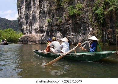 Vietnamese people and foreign traveler travel visit and amazing boat tour trip Tam Coc Bich Dong or Halong Bay on Land and Ngo Dong river and cave of limestone mountains at Ninh Binh in Hanoi, Vietnam