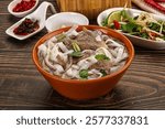 Vietnamese Pho Bo soup with beef, noodles, cilantro and spices