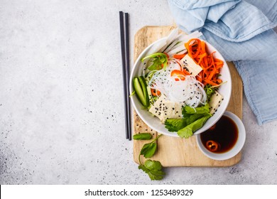 Vietnamese Rice Noodle With Tofu And Chilli Vegetables Salad In White Bowl, Top View, Copy Space.