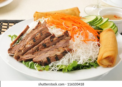 A Vietnamese salad with beer, cucumbers, greens and rice noodles