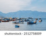 Vietnamese traditional boats at sea at the port in a fishing village near Nha Trang in Vietnam during the summer day