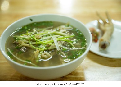 Vietnamese Traditional Noodle Soup Pho And Boiled Chicken Foot Served In A Local Restaurant In Hanoi, Vietnam