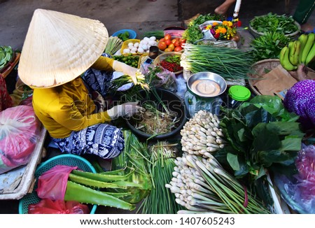 Vietnamese vendor sell vegetables in the  morning at local market in Vietnam