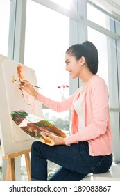 Vietnamese Woman Drawing A Portrait, Sideview