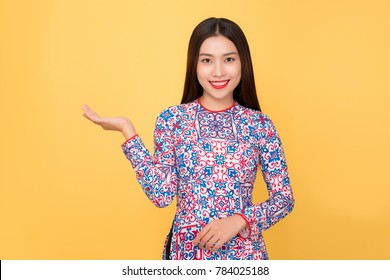 Vietnamese woman traditional festival costume Ao Dai. Tet holiday. Lunar New Year. - Powered by Shutterstock