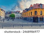 Vieux Lille old town quarter with empty narrow cobblestone street, paving stone square with old colorful buildings in historical city centre, French Flanders, Hauts-de-France Region, Northern France