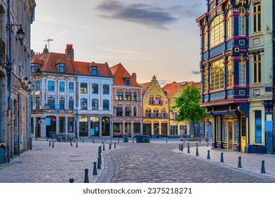 Vieux Lille old town quarter with empty narrow cobblestone street, paving stone square with old colorful buildings in historical city centre, French Flanders, Hauts-de-France Region, Northern France