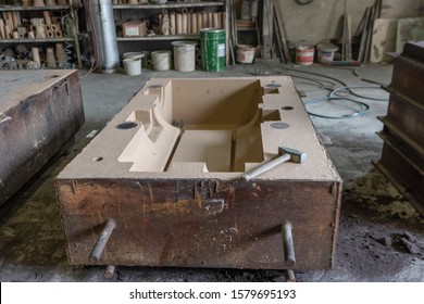 Viev of the sand mold of the steel valve for casting. In sand molding a pattern is used to make the cavity in the sand. The pattern has the same shape as the casting which it makes. - Powered by Shutterstock