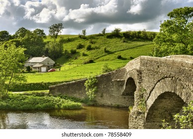 A View Of The 16th Century Packhorse Bridge On The Dales Way At Lowgill, Cumbria.