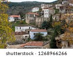 View of the abandoned historical village of Prastos in Peloponnese, Greece. The village is well-known for its traditional tower houses.