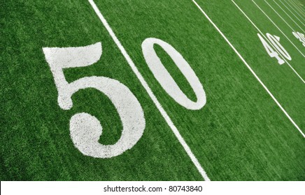 View From Above Of 50 Yard Line On American Football Field With Artificial Turf