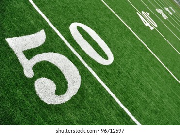 View From Above Of 50 Yard Line On American Football Field With Artificial Turf