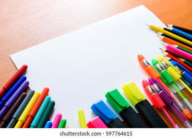 View From Above. Artistic Work Tools On White Wooden Table.