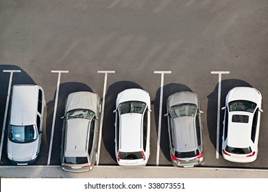 View From Above Of Car Parking Full Of Vehicles.