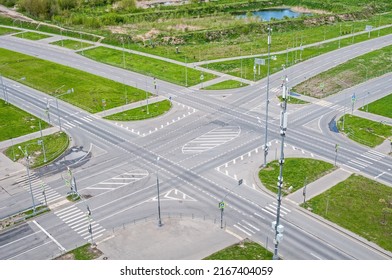 View Above Of Empty Street Intersection, With Crosswalk Markings And Traffic Signal Lights