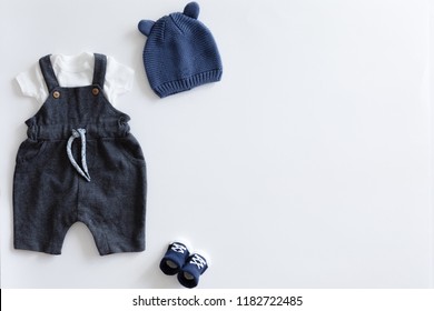 View From Above Of Fashion Trendy Stuff On White Background For Newborn Baby Boy, Flat Lay.