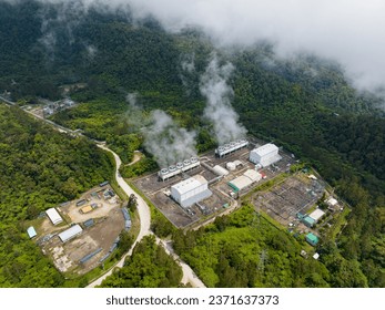 View from above of Geothermal power station with steam and pipes. Renewable energy production at a power station that supplies electricity in Mindanao, Philippines.