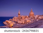 View from above of the golden dome of church and roofs with church of Our Lady of Mount Carmel and St. Paul