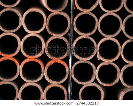 view from above into empty tubes of a pyrotechnic cake firework launcher
