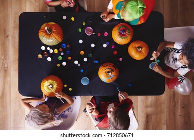 View From Above Kids Painting Pumpkins 
