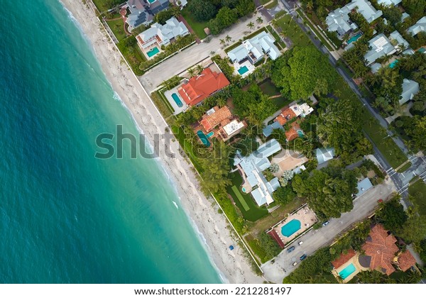 View from above of large residential houses in\
island small town Boca Grande on Gasparilla Island in southwest\
Florida. American dream homes as example of real estate development\
in US suburbs