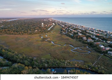 A view from above of the marsh along Oak Island NC. the water snakes around around the island.