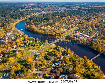 The View from Above of The Ogre River, Bridges and Houses in the Autumn Time, Ogre, Latvia