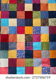 View from above on a assembled patchwork blanket before it will be quilted in the sewing machine