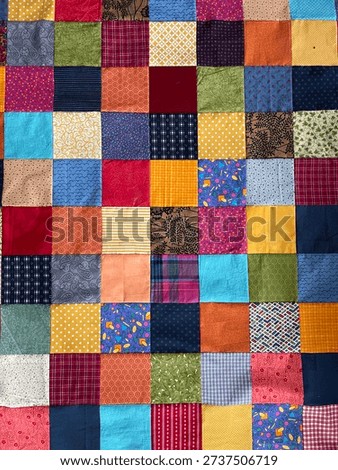 View from above on a assembled patchwork blanket before it will be quilted in the sewing machine