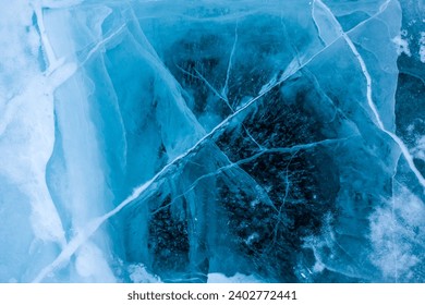 View from above on beautiful frozen Baikal lake with cracks on the transparent ice surface background for adverting content   - Powered by Shutterstock