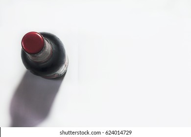 View From Above On Beer Bottle With Red Cap