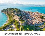View from above on Nafplio city in Greece with port, Bourtzi fortress and blue Mediterranean sea soft focus