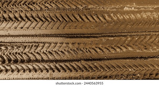 view from above on texture of wet muddy road from above on surface of wet gravel road with tractor tire tracks in countryside - Powered by Shutterstock