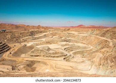View from above of the pit of an open-pit copper mine in Chile