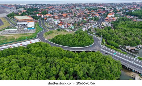 View From Above Of Ring Road Toll Way Structure Blend With Group Of Green Tress On The Side.