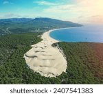 View from above of seascape with sandy Dune and pine forest. Playa Bolonia. Duna de Bolonia. Spain, Europe