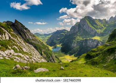 View from above of the Seealpsee, surrounded by the Swiss Alps. Canton of Appenzell, Switzerland.
