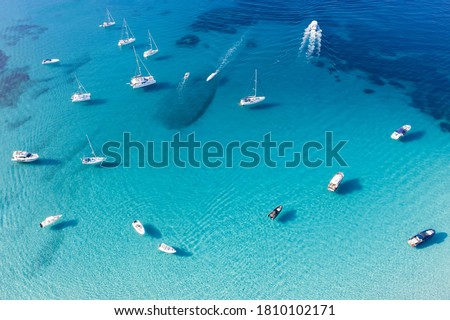 View from above, stunning aerial view of a bay with boats and luxury yachts sailing on a turquoise, clear water. Grande Pevero, Emerald Coast (Costa Smeralda) Sardinia, Italy.