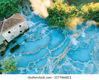 View from above, stunning aerial view of Le Cascate del Mulino, a group of beautiful hot springs in the municipality of Manciano, Tuscany. - Shutterstock ID 2177466811
