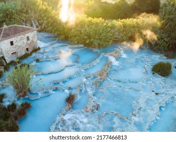 View from above, stunning aerial view of Le Cascate del Mulino, a group of beautiful hot springs in the municipality of Manciano, Tuscany. - Powered by Shutterstock