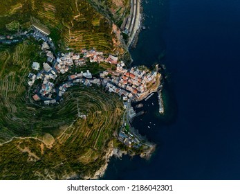 View from above, stunning aerial view of Manarola, the second village of the Cinque Terre coming from La Spezia. Manarola is the most picturesque village, made up of colorful tower-houses.