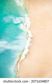 View From Above, Stunning Aerial View Of A Person Relaxing On A Beautiful Beach Bathed By A Turquoise Sea During Sunset. Kelingking Beach, Nusa Penida, Indonesia.