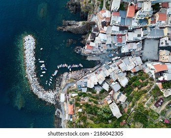 View from above, stunning aerial view of Riomaggiore during a beautiful sunset. Riomaggiore is the most picturesque and the first village of the Cinque Terre coming from La Spezia, Liguria, Italy.